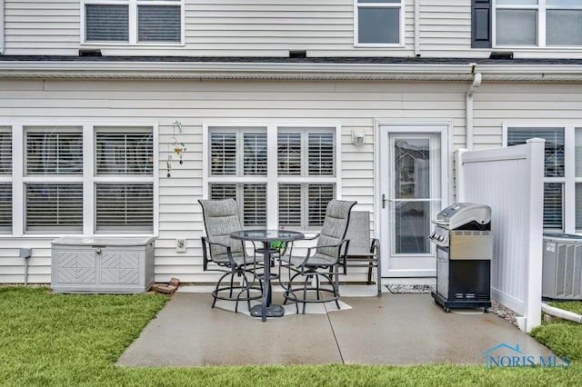 view of patio featuring grilling area and cooling unit