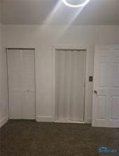 unfurnished bedroom featuring multiple closets