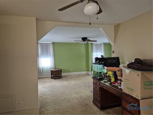 office area featuring carpet floors, baseboards, and a ceiling fan