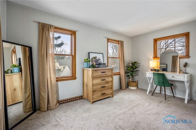 office featuring a wealth of natural light, carpet, and visible vents