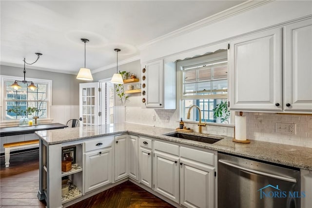 kitchen featuring white cabinets, dishwasher, a peninsula, open shelves, and a sink