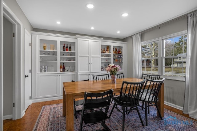 dining space featuring recessed lighting and baseboards