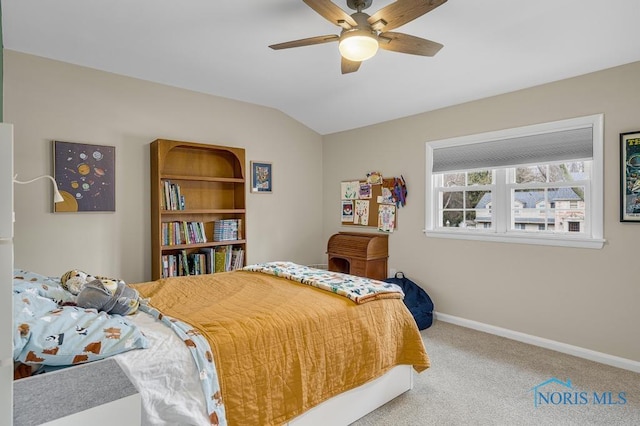 carpeted bedroom with ceiling fan, baseboards, and vaulted ceiling