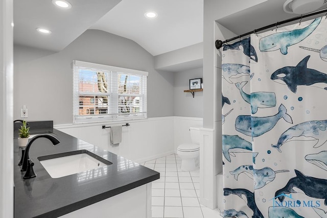 bathroom featuring toilet, recessed lighting, vanity, vaulted ceiling, and tile patterned floors