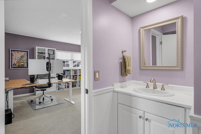 bathroom with wainscoting and vanity