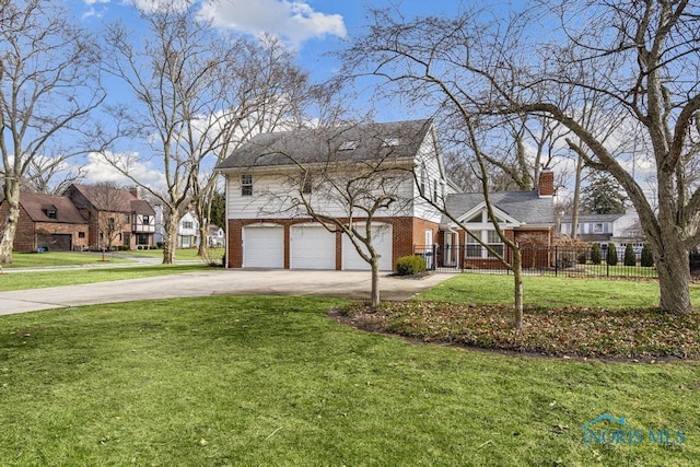 view of front of home with brick siding, fence, driveway, a residential view, and a front lawn