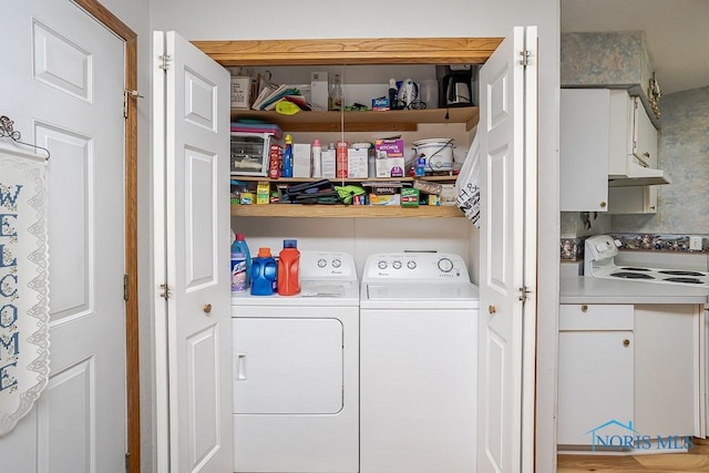 clothes washing area with laundry area and washing machine and clothes dryer