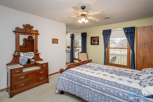 bedroom featuring light colored carpet, ceiling fan, visible vents, and baseboards