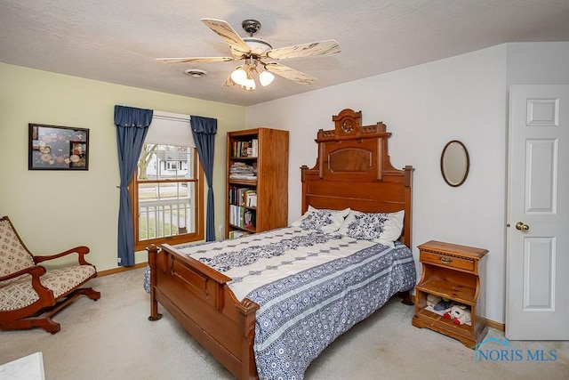 bedroom with visible vents, a ceiling fan, carpet flooring, a textured ceiling, and baseboards