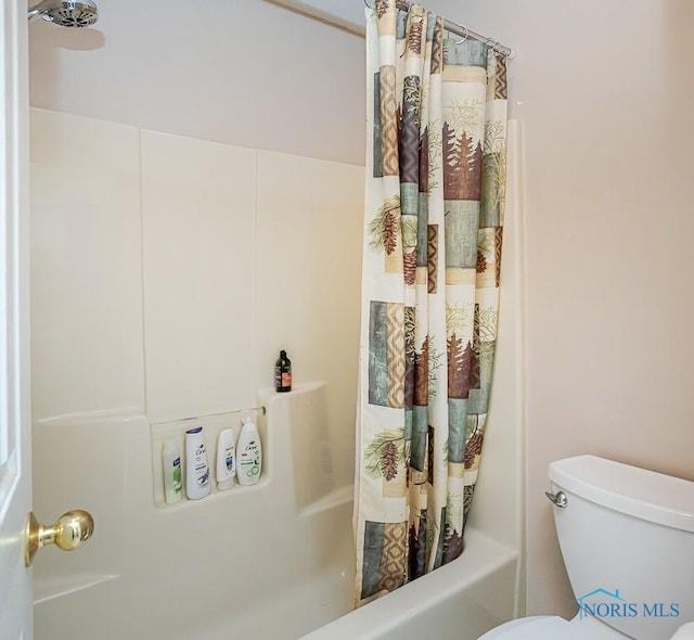 bathroom with toilet and shower / bathtub combination with curtain