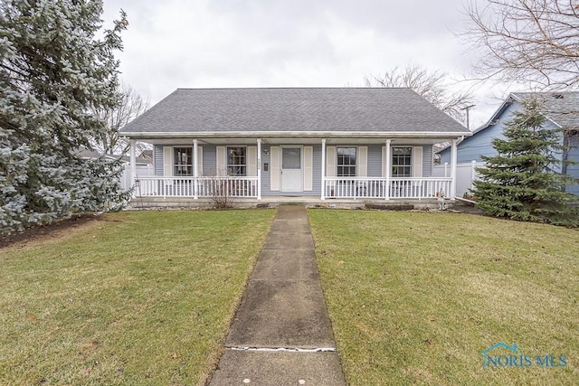 view of front of home with a front yard, a porch, and roof with shingles