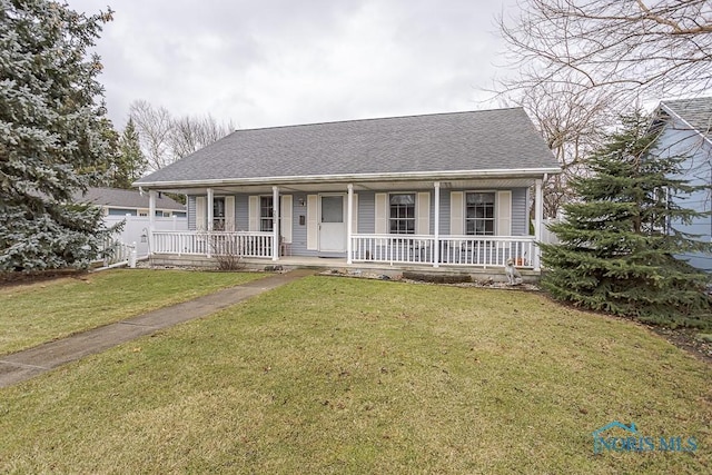 view of front of home featuring covered porch, roof with shingles, and a front lawn