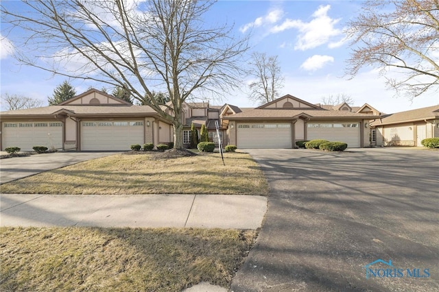 view of front of home featuring an attached garage and concrete driveway