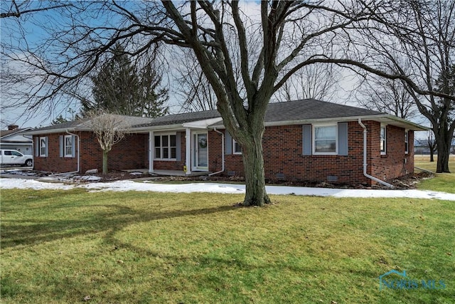 ranch-style house featuring crawl space, a lawn, and brick siding