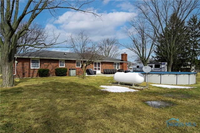 exterior space featuring a covered pool and central AC