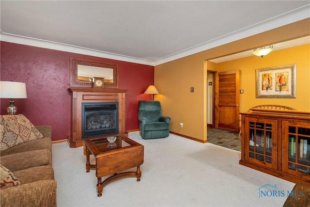 carpeted living area with a glass covered fireplace and baseboards