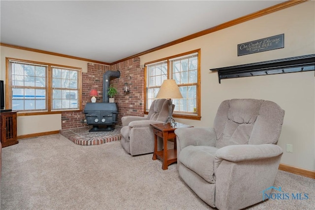 carpeted living area featuring a wood stove, baseboards, and ornamental molding