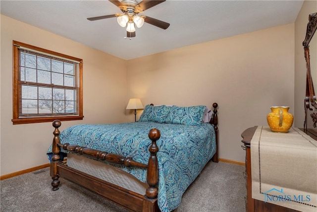 carpeted bedroom with visible vents, ceiling fan, and baseboards