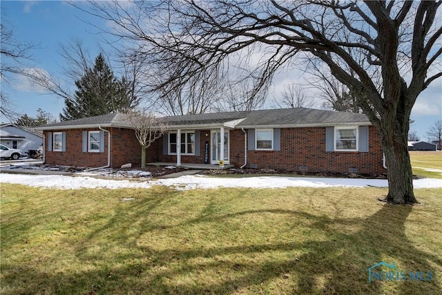 ranch-style home featuring crawl space, brick siding, and a yard