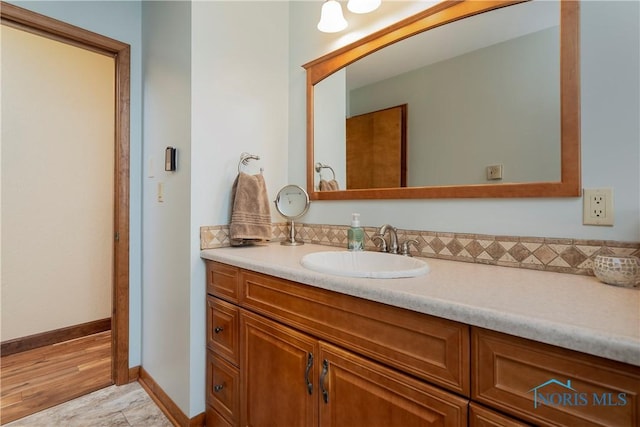 bathroom featuring vanity and baseboards