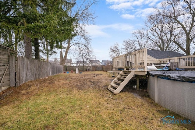 4526 Eastway St, Toledo, OH 43612 - view of yard featuring a fenced in pool, a wooden deck, and a fenced backyard
