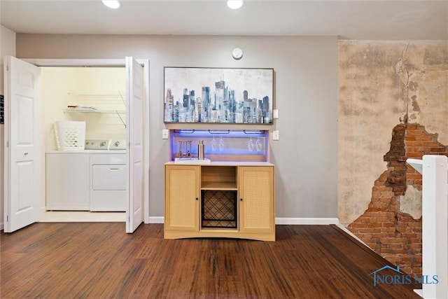 bar featuring recessed lighting, dark wood-style flooring, baseboards, and separate washer and dryer