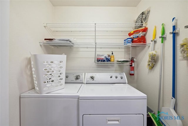 clothes washing area with laundry area and washer and dryer