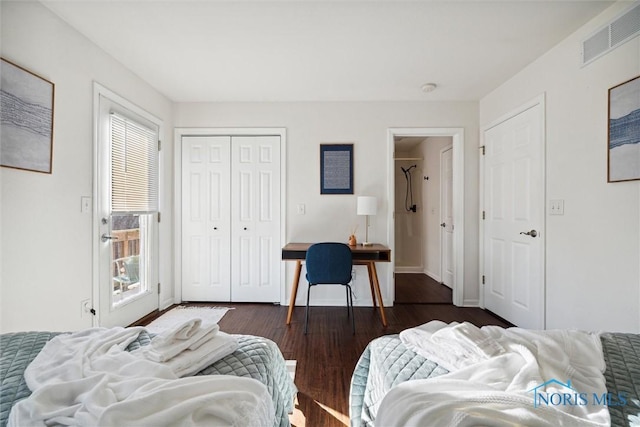 bedroom featuring baseboards, visible vents, and dark wood-type flooring