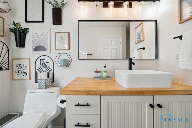 bathroom with vanity and toilet