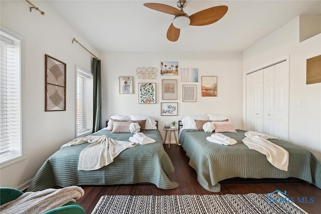 bedroom with ceiling fan, a closet, and wood finished floors