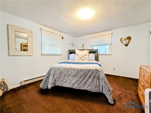 bedroom featuring carpet floors, a baseboard radiator, a textured ceiling, and baseboards