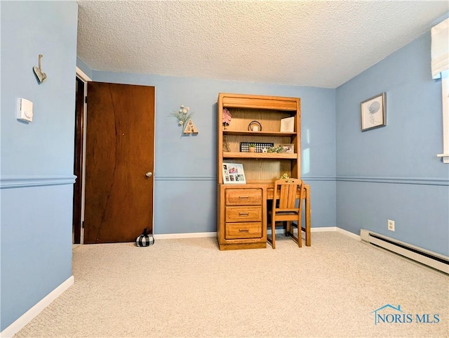 carpeted office featuring a textured ceiling, a baseboard heating unit, and baseboards