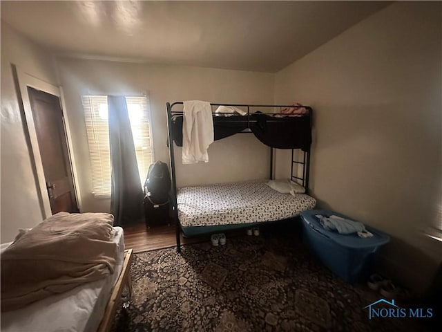 bedroom with wood finished floors