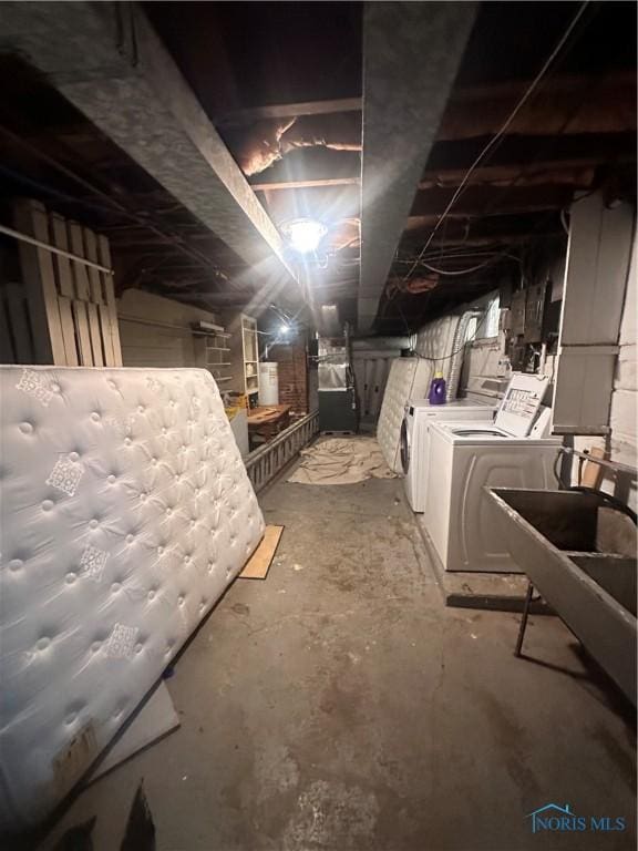 unfinished below grade area with washing machine and dryer