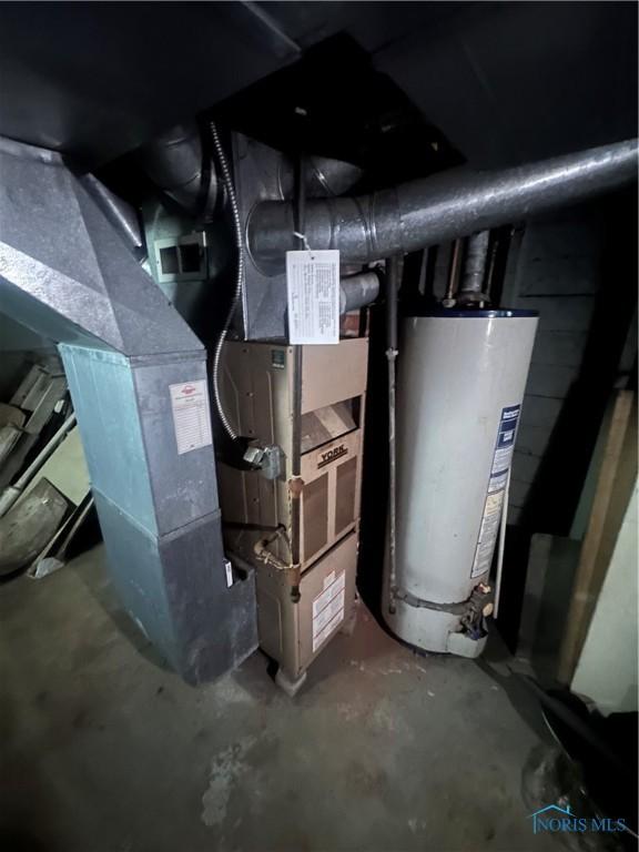 utility room featuring gas water heater