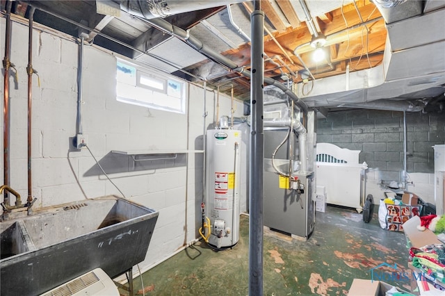 basement with heating unit, water heater, and a sink