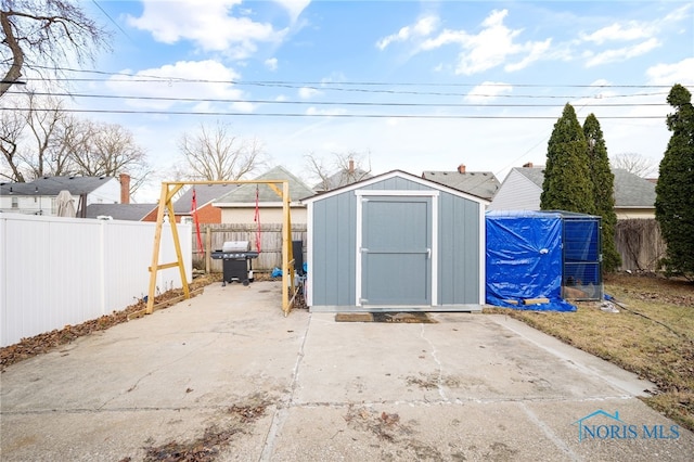 view of shed featuring a fenced backyard