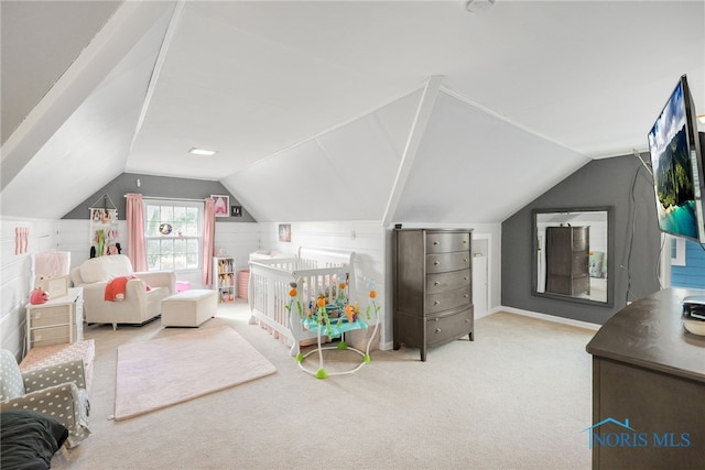 carpeted bedroom featuring lofted ceiling