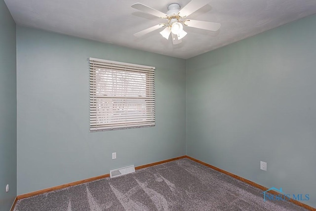 unfurnished room with ceiling fan, carpet flooring, visible vents, and baseboards