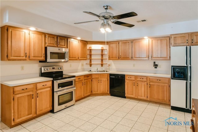 kitchen featuring visible vents, ceiling fan, appliances with stainless steel finishes, light countertops, and a sink