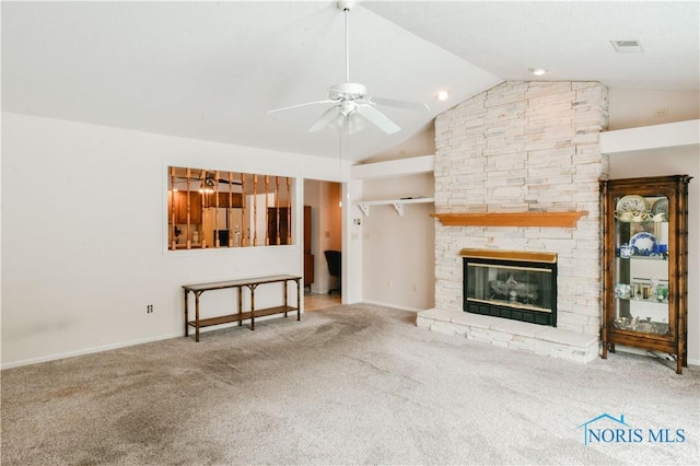 unfurnished living room with visible vents, ceiling fan, carpet, a fireplace, and high vaulted ceiling