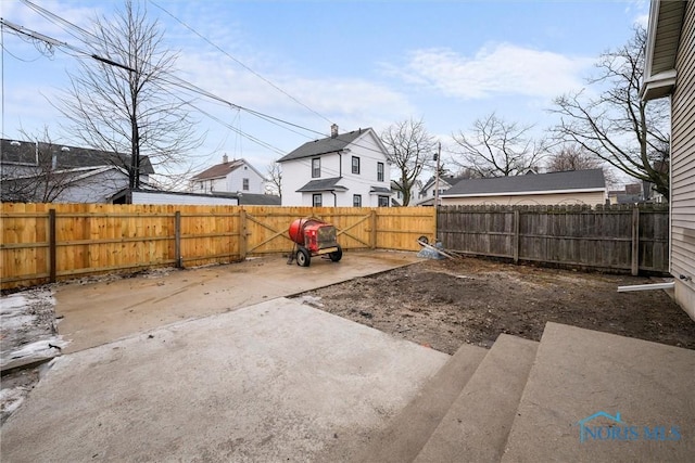 view of yard with a patio area and a fenced backyard