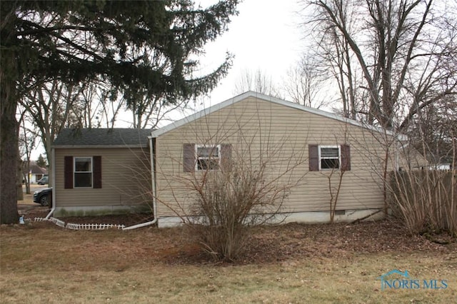 view of side of property with crawl space