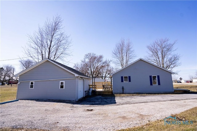 view of home's exterior featuring an outbuilding