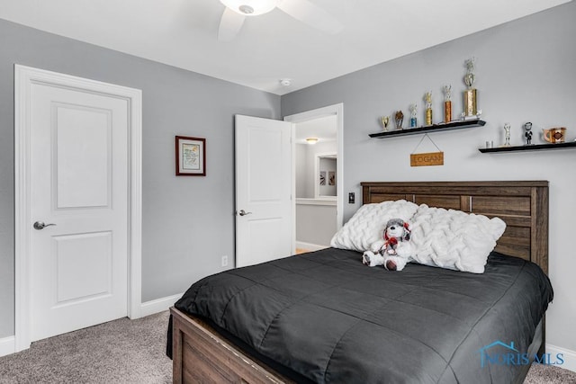 bedroom featuring ceiling fan, carpet flooring, and baseboards