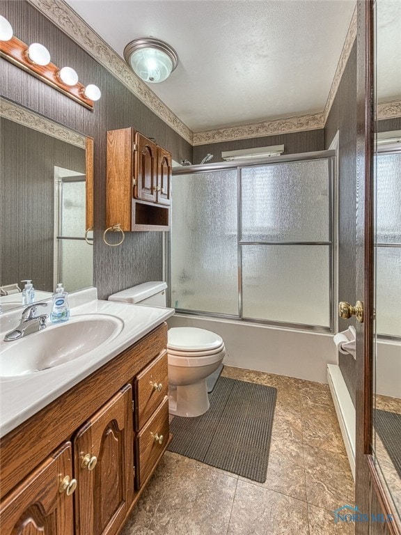 full bathroom featuring enclosed tub / shower combo, vanity, toilet, and wallpapered walls