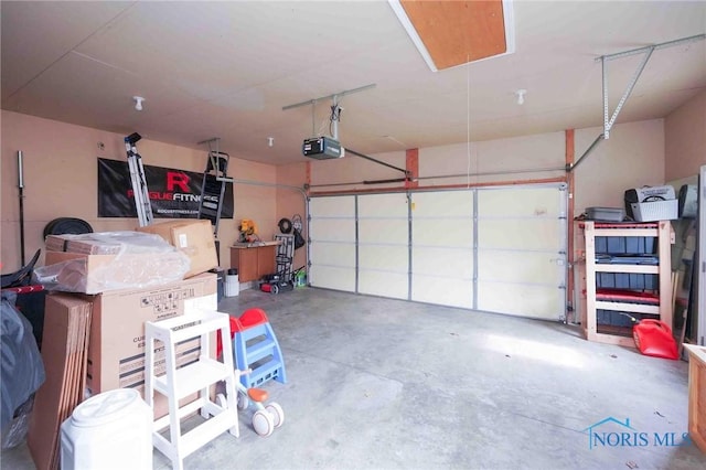 garage featuring a garage door opener