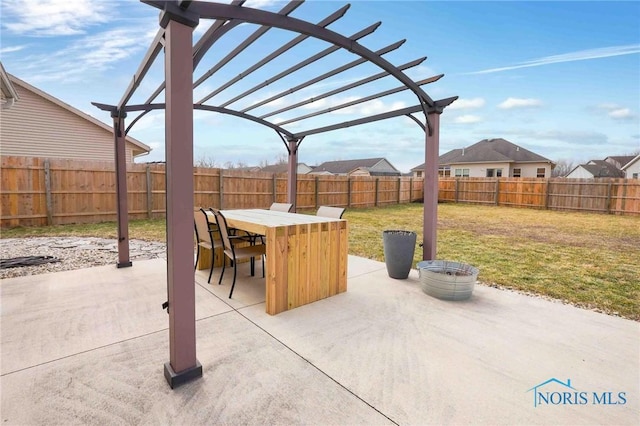 view of patio featuring a fenced backyard, outdoor dining area, and a pergola