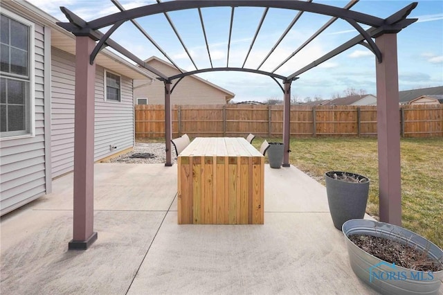 view of patio with outdoor dining area, a fenced backyard, and a pergola