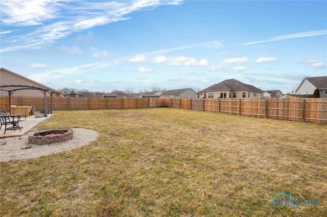 view of yard featuring an outdoor fire pit, a patio area, a fenced backyard, and a gazebo